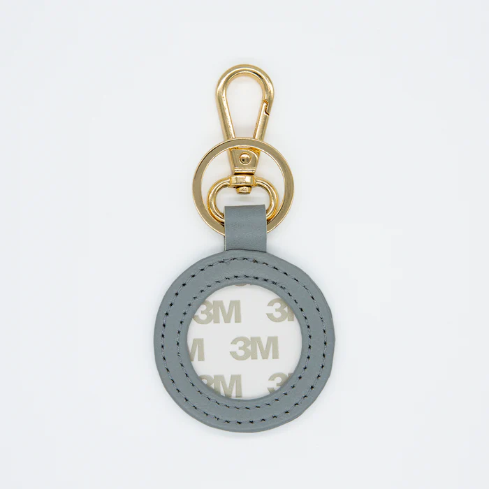 Gray keychain with gold clasp on a white background