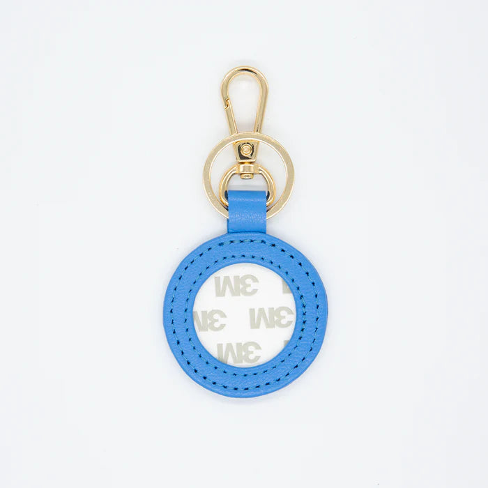 Blue keychain with gold clasp on a white background